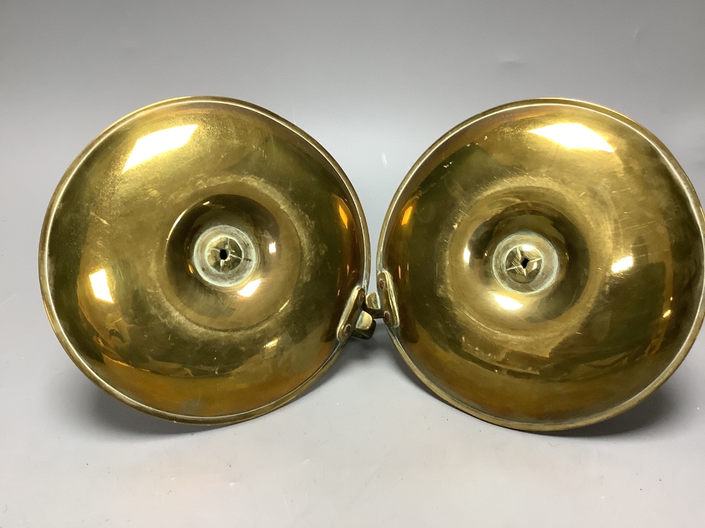 A pair of Regency brass ejector chambersticks (lacking snuffers) and an early 19th century wrought iron rushlight holder